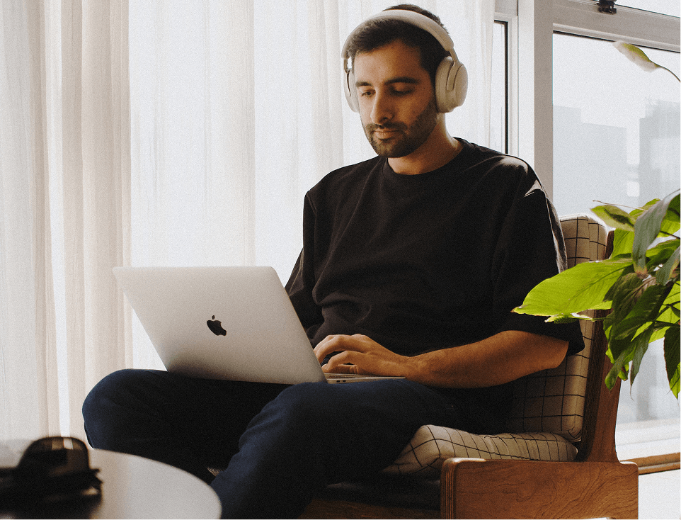 Person sitting with a laptop 