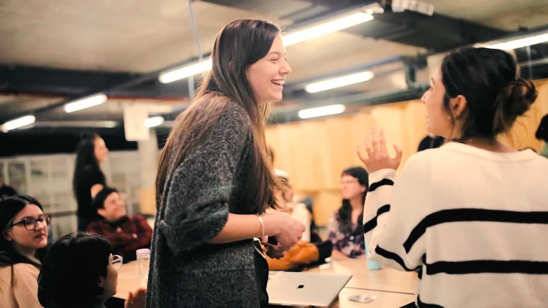 person smiling and chatting